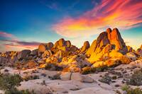 Rocks in Joshua Tree National Park illuminated by sunset