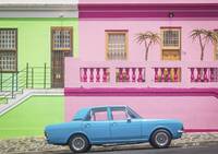 Blue vintage car in front of colourful houses in Bo-Kaap, Cape Town